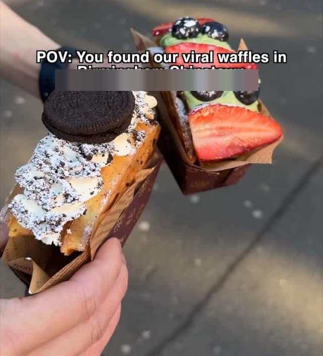 Two viral waffles in brown takeaway boxes — an Oreo-cream waffle and a matcha-berry waffle.